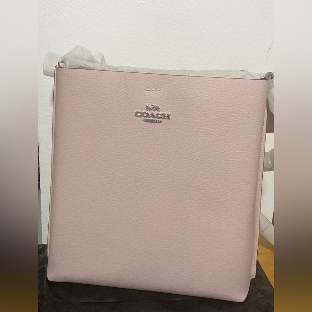 Coach pale pink messenger bag.